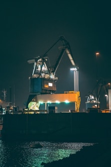 blue and orange crane during night time