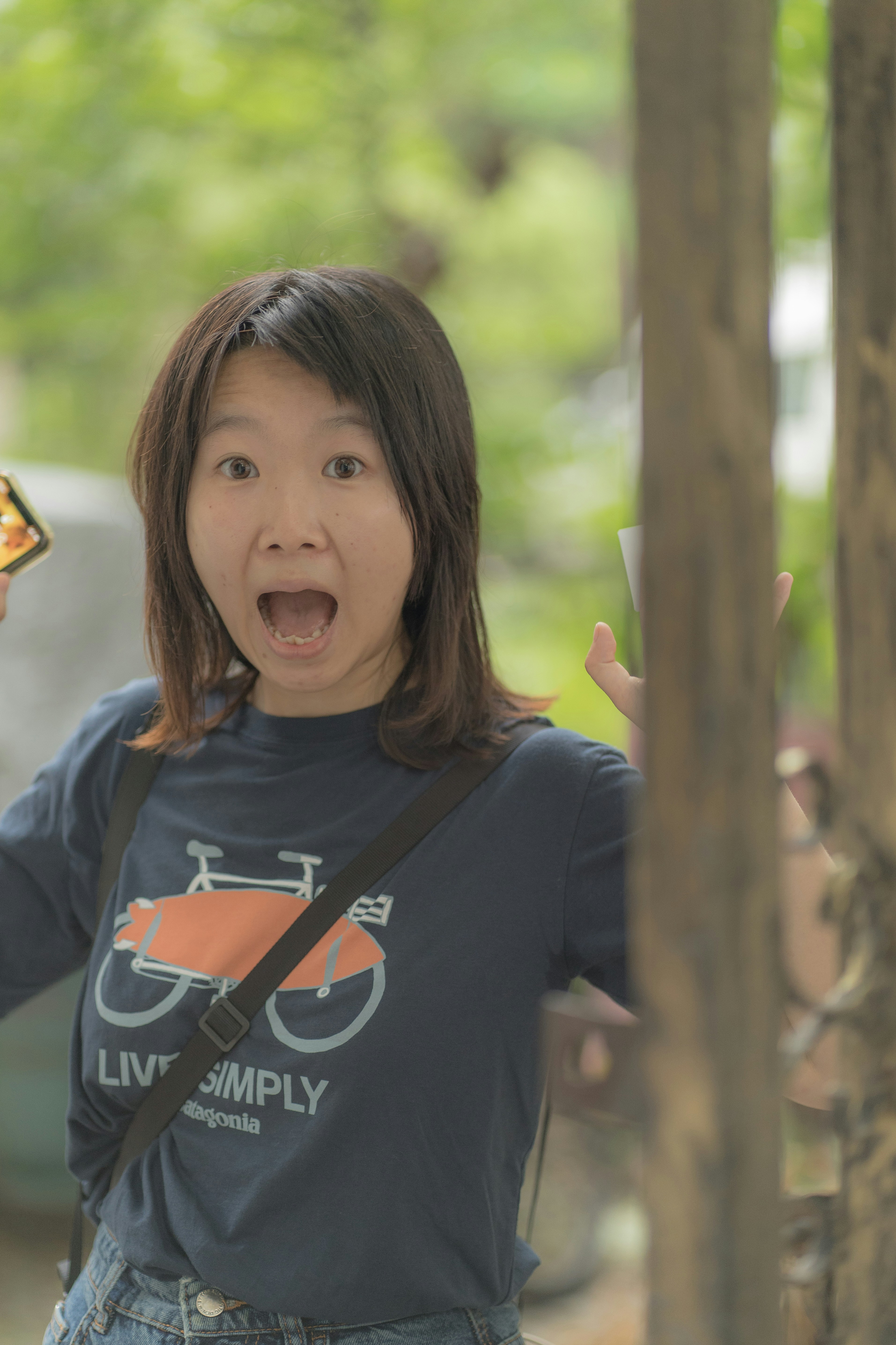 Girl looking at phone with shocked expression, dramatic lighting, emotional breakdown cinematic scene
