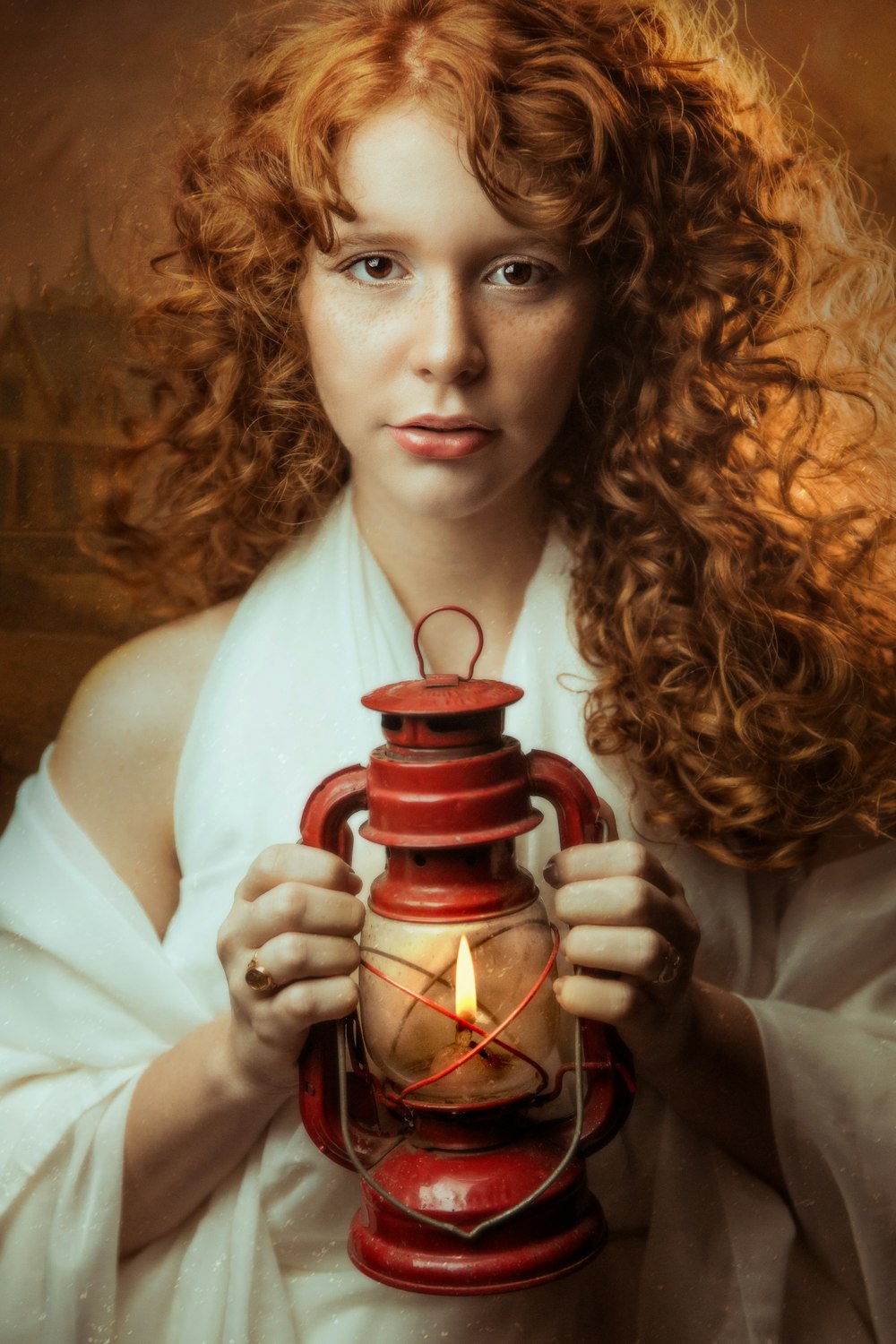 woman in white long sleeve shirt holding red and black ceramic mug