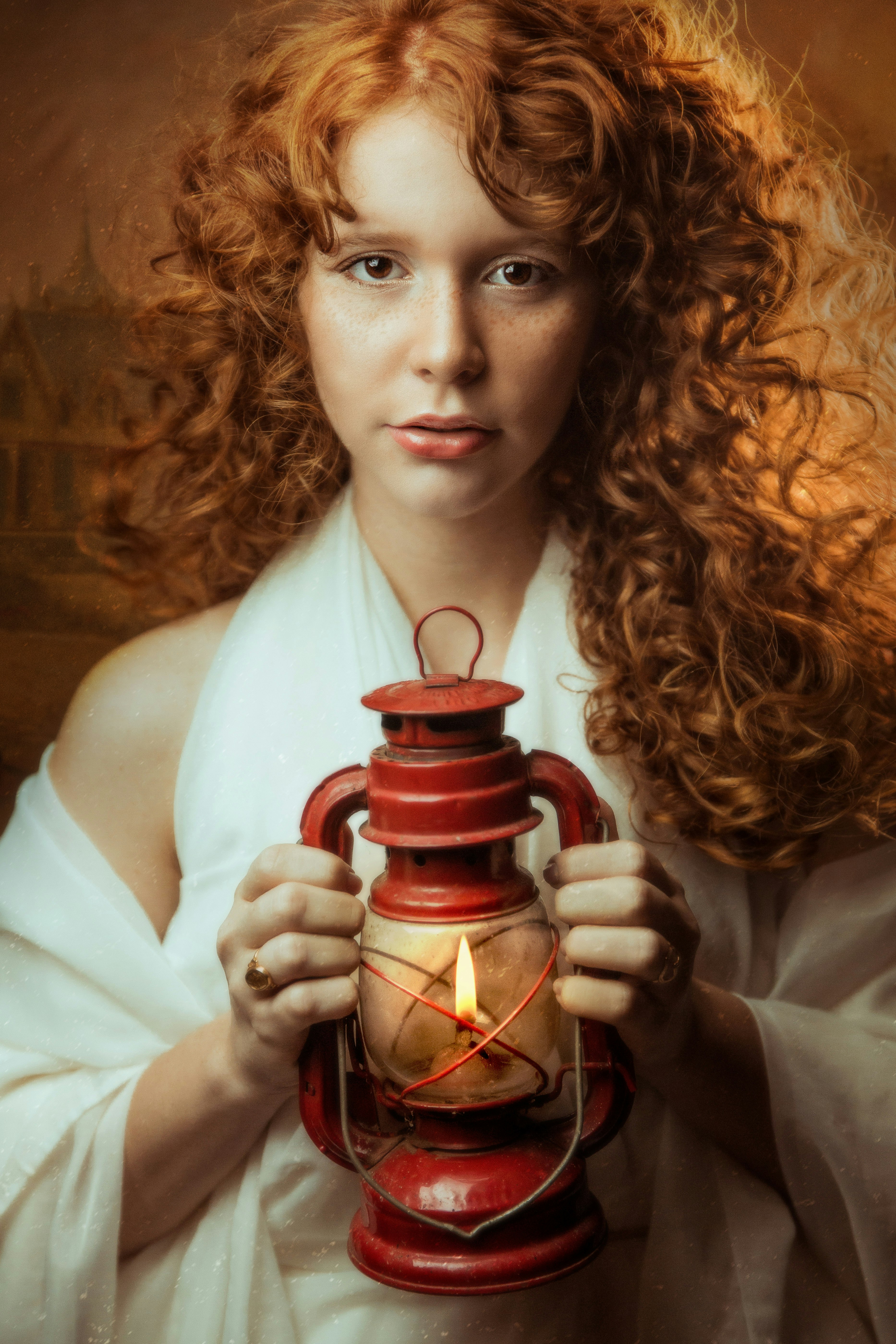 woman in white long sleeve shirt holding red and black ceramic mug