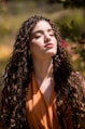 woman in orange collared shirt