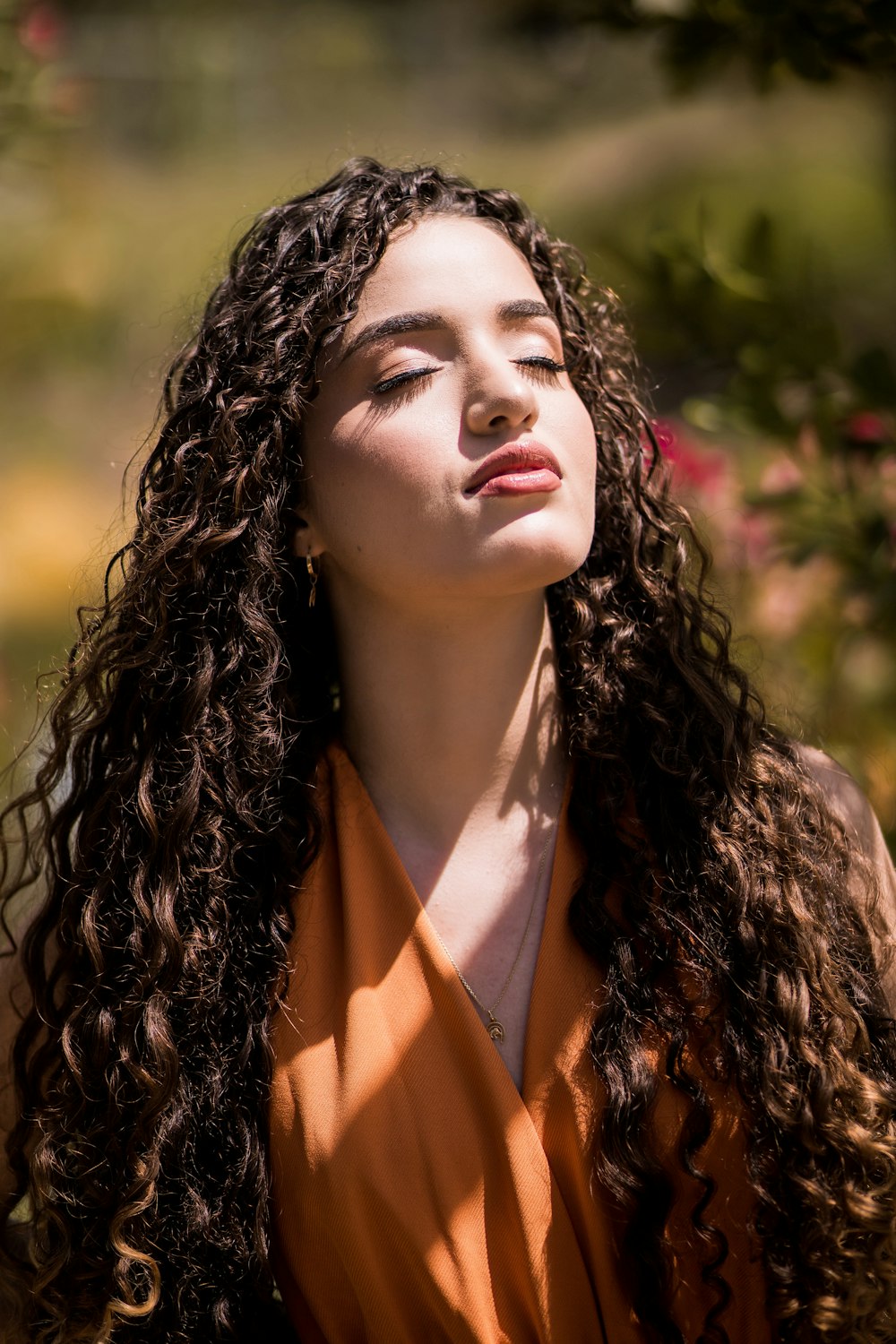 woman in orange collared shirt