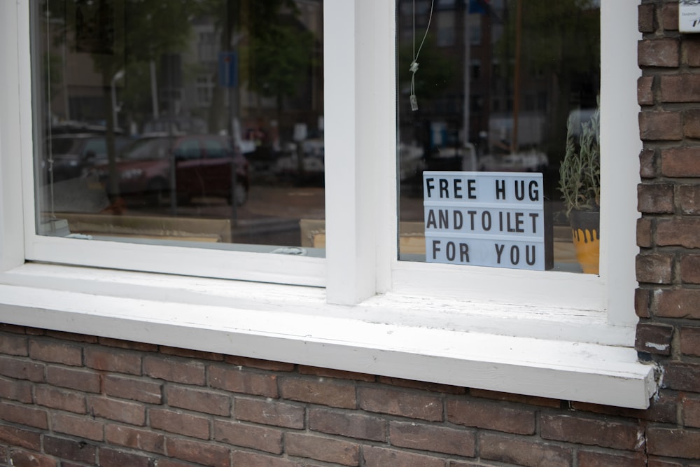 white wooden framed glass window