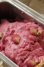 strawberry ice cream in clear plastic container