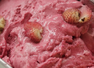 strawberry ice cream in clear plastic container