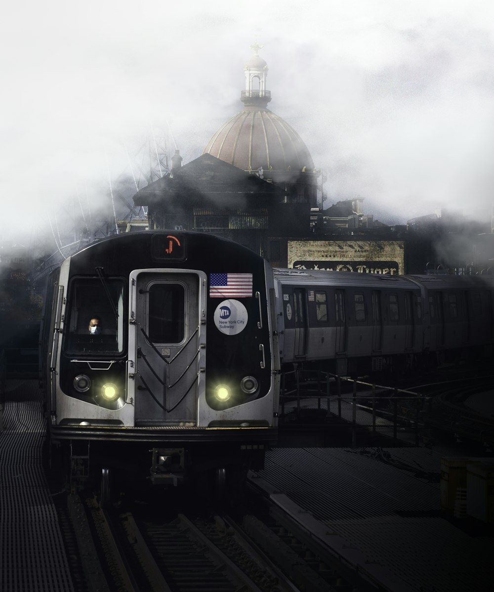 green and black train on rail tracks