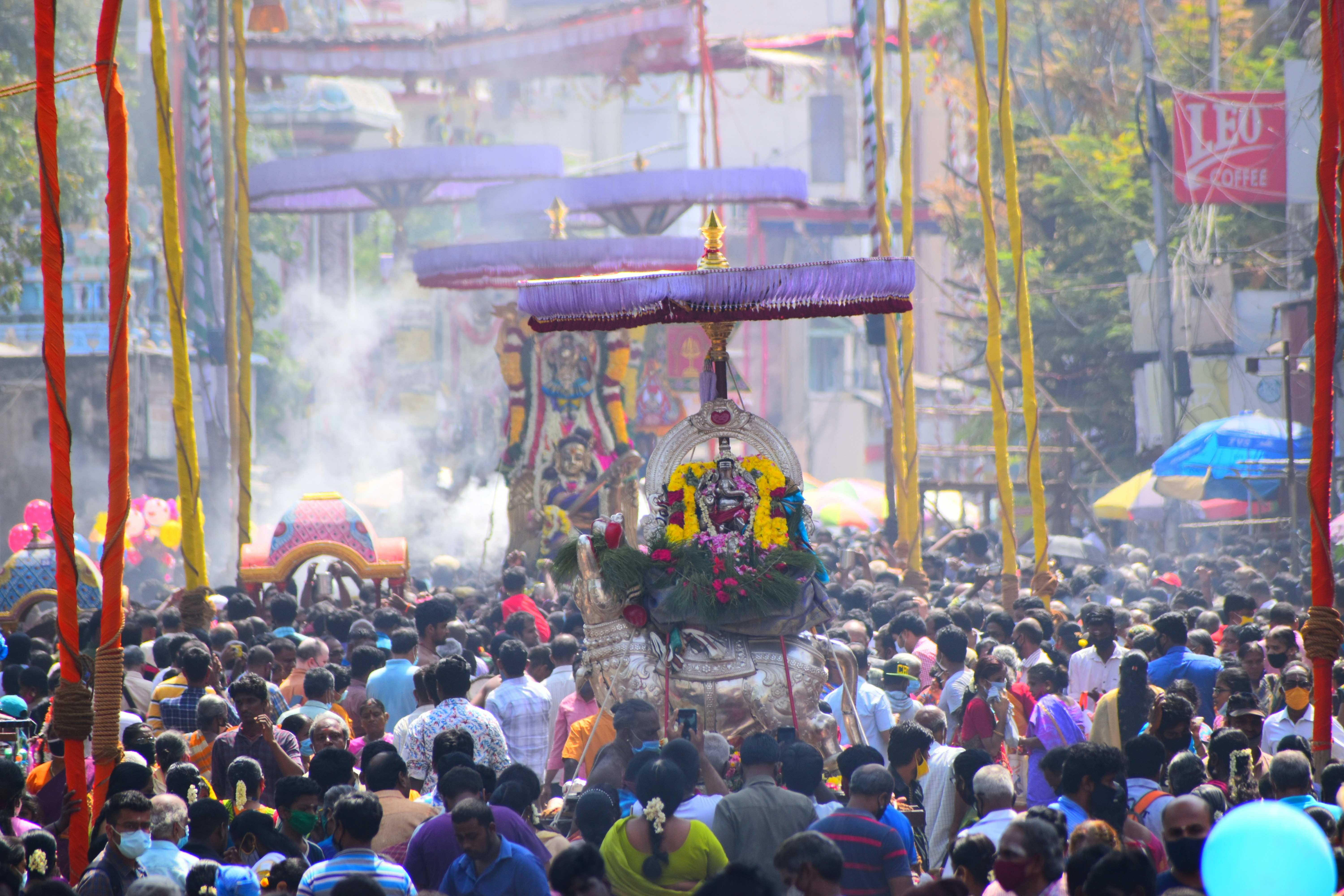 a large group of people walking down a street