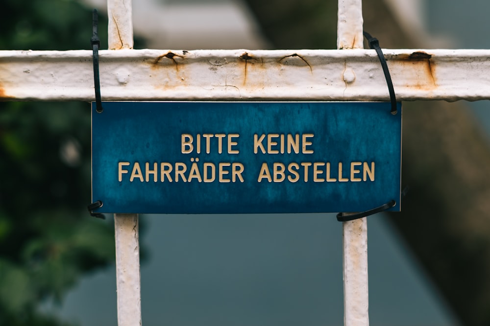 blue and white wooden signage