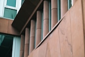 A modern building facade featuring elegant marble and granite finishes.
