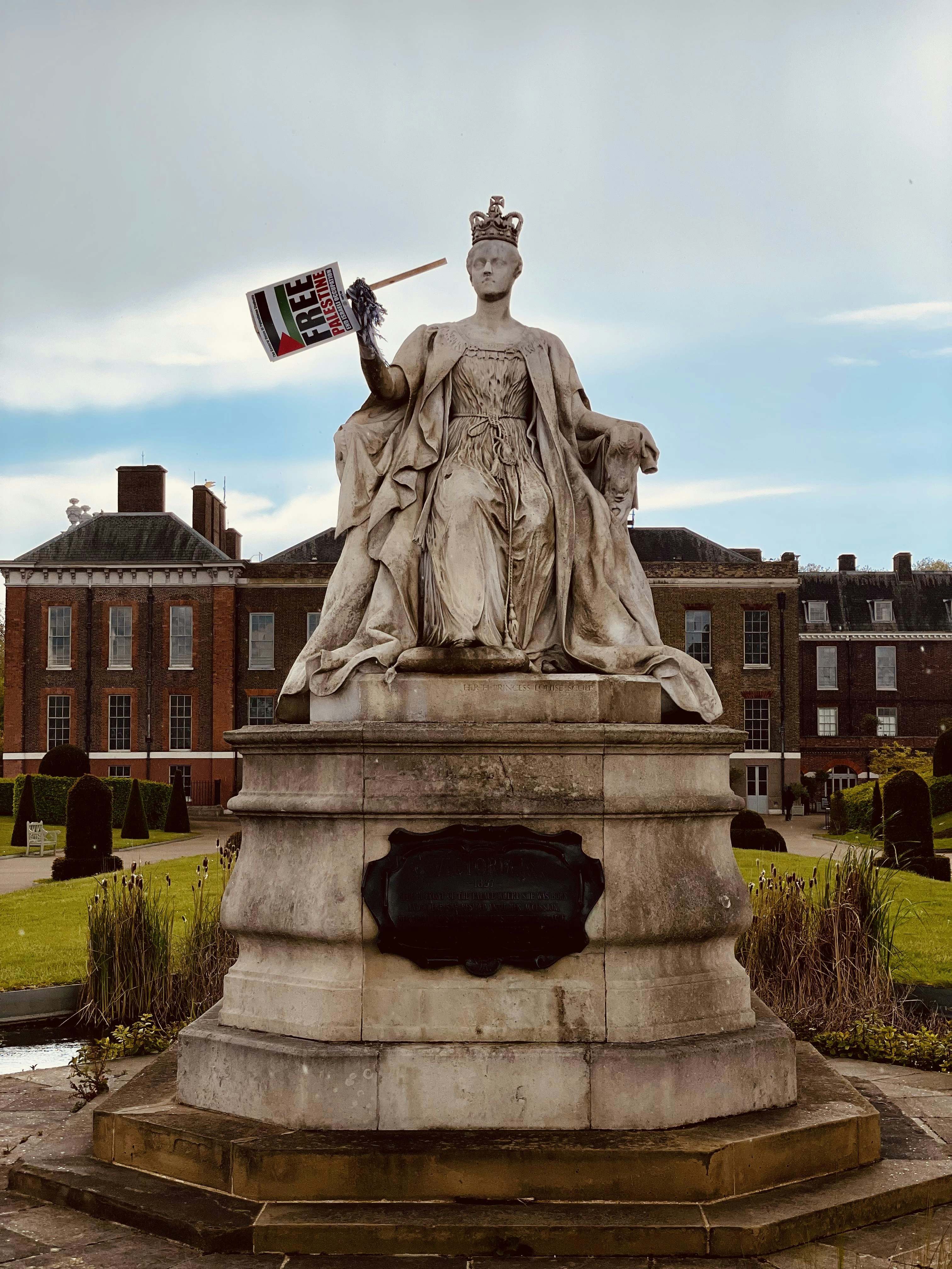 statue of man holding flag of america