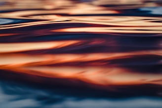 Dynamic painting capturing the fluidity of a swimmer’s stroke, with emphasis on water movement and muscle strain.