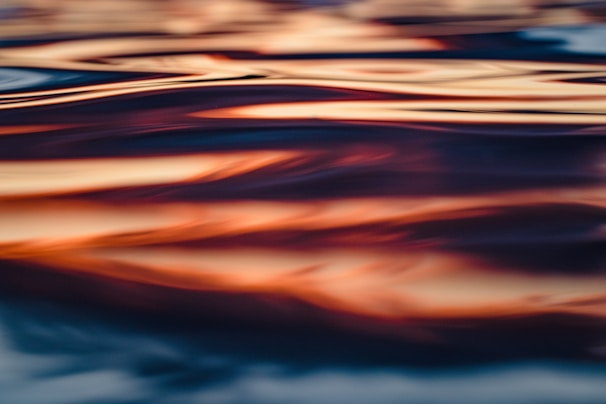 Dynamic painting capturing the fluidity of a swimmer’s stroke, with emphasis on water movement and muscle strain.