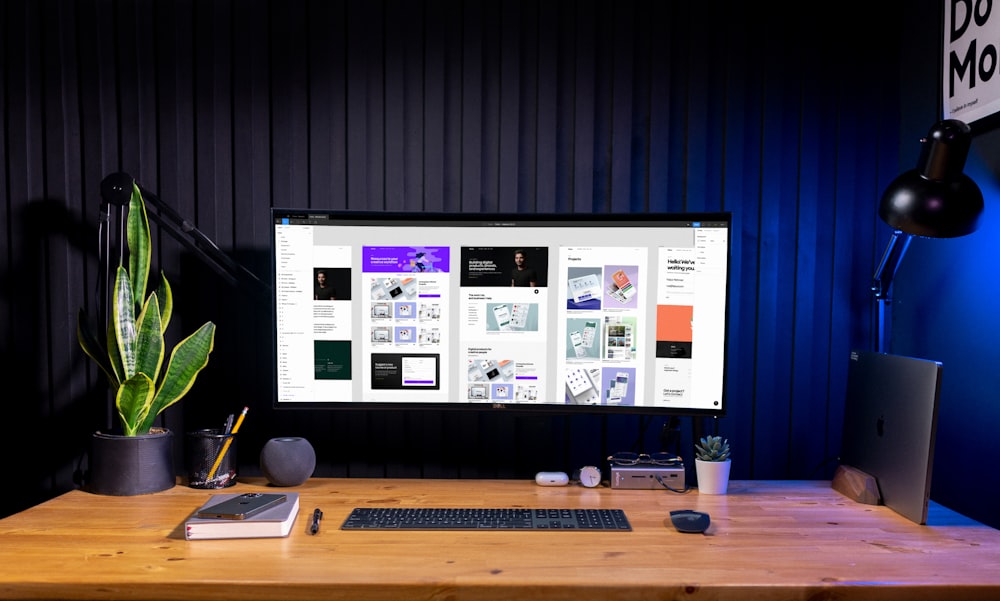 silver imac on brown wooden table