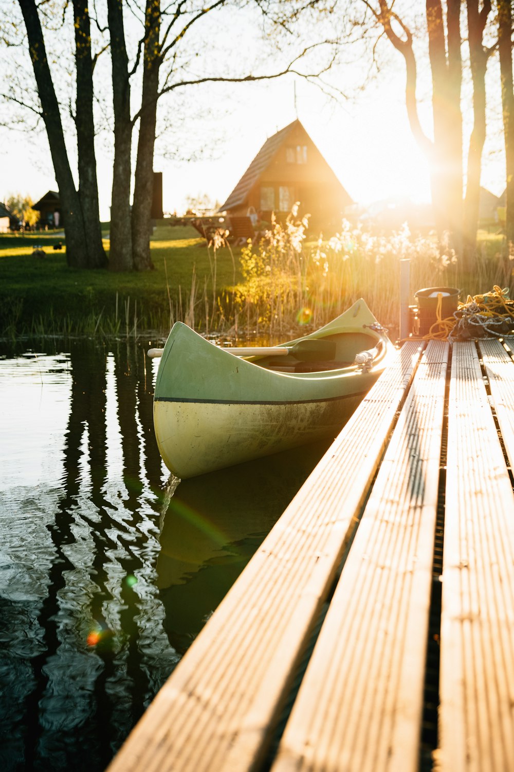 white boat on dock during sunset