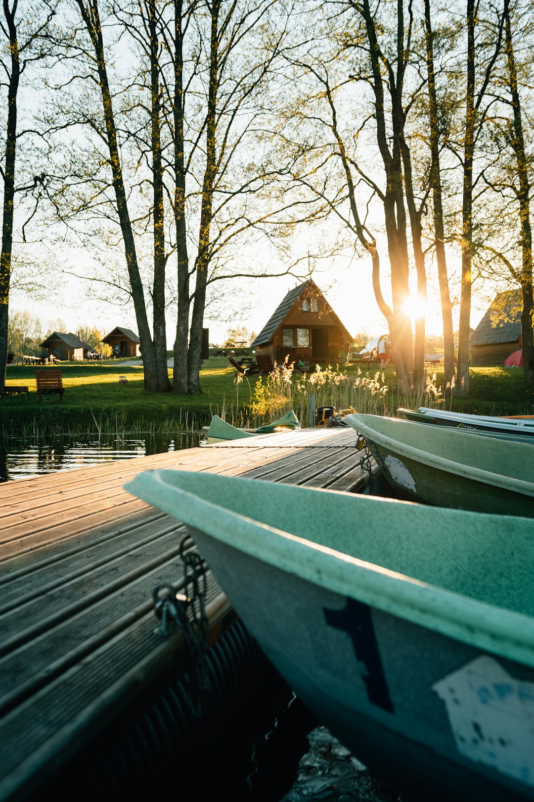 white boat on dock during sunset