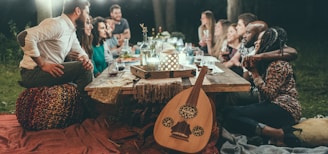 people sitting on chair in front of table with candles and candles