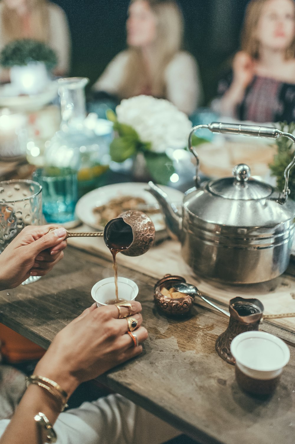 person holding stainless steel cooking pot pouring white powder on silver steel bowl