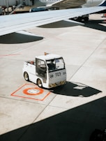 A ground support equipment vehicle parked on an airport tarmac.