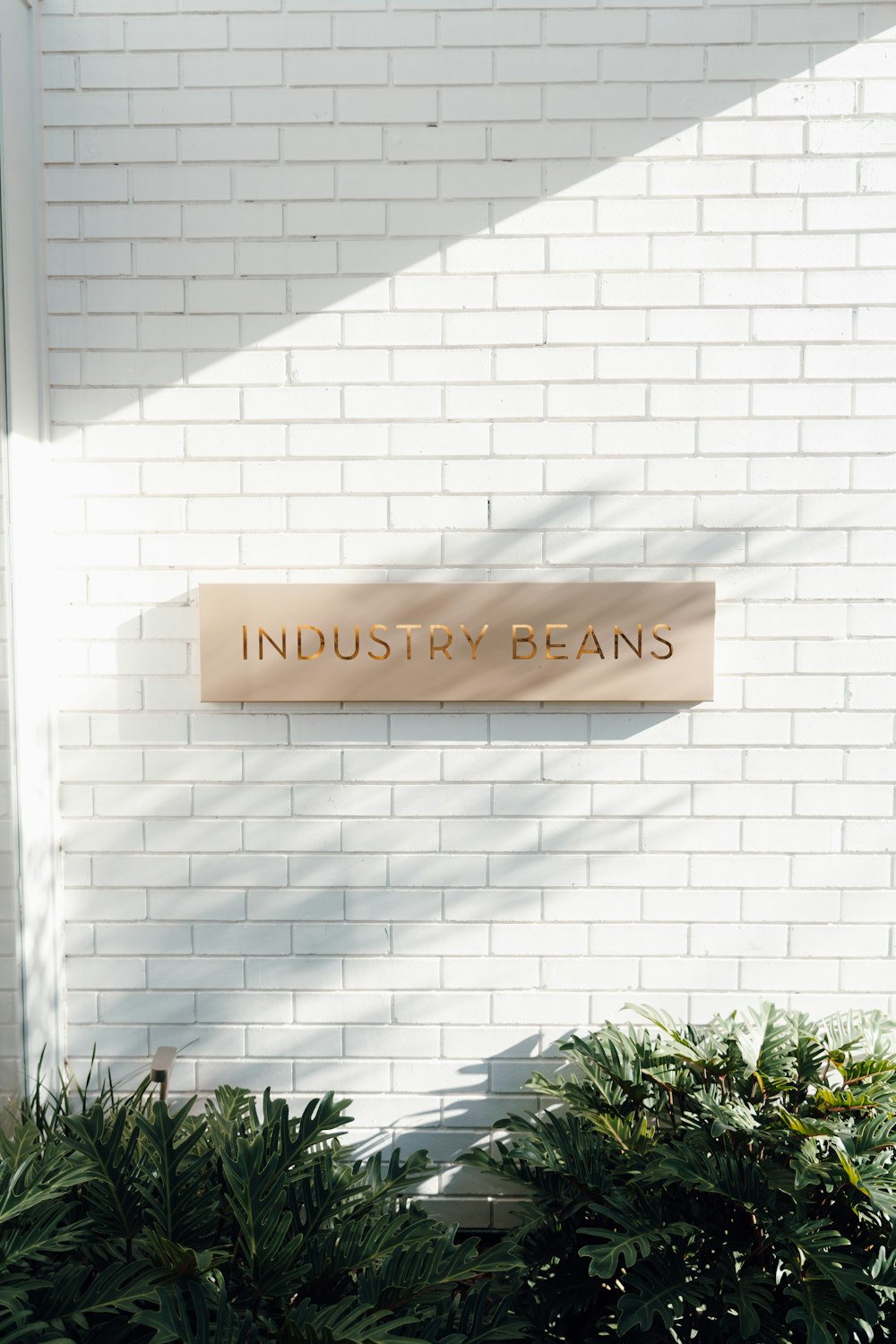 a brick building with a sign that says industry beans
