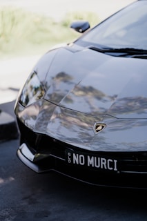 Shiny white Lamborghini with a mirror-like finish reflecting the Miami skyline