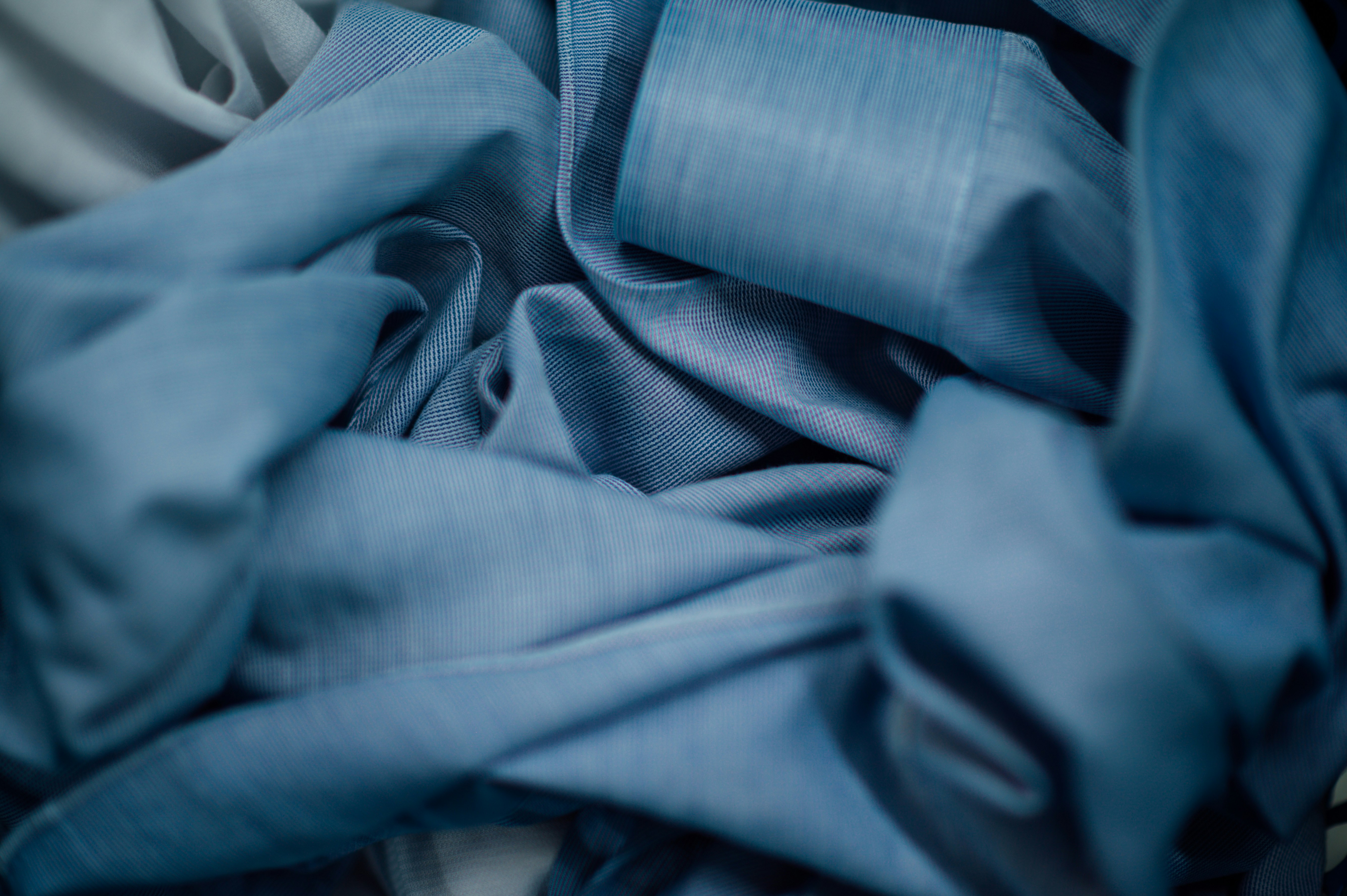 blue textile on white textile
