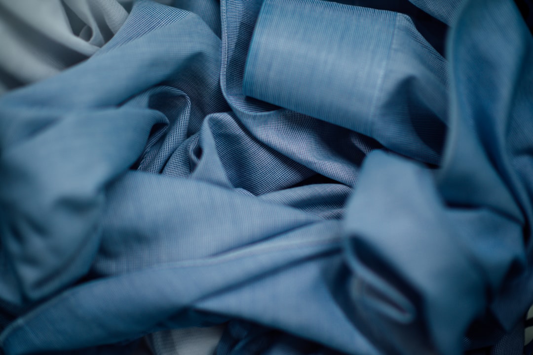 blue textile on white textile