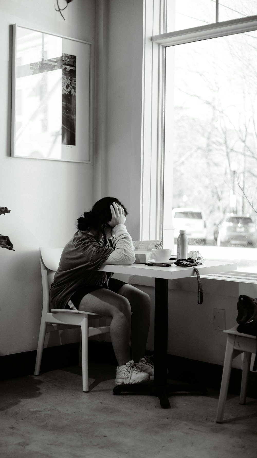 woman in white long sleeve shirt sitting on chair