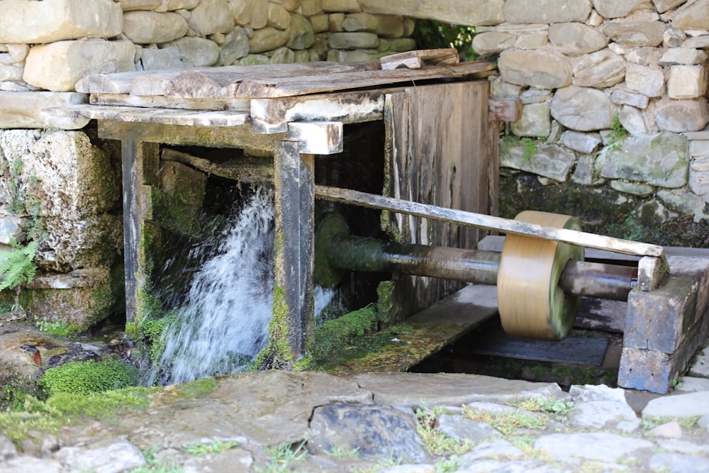 brown wooden water well with water