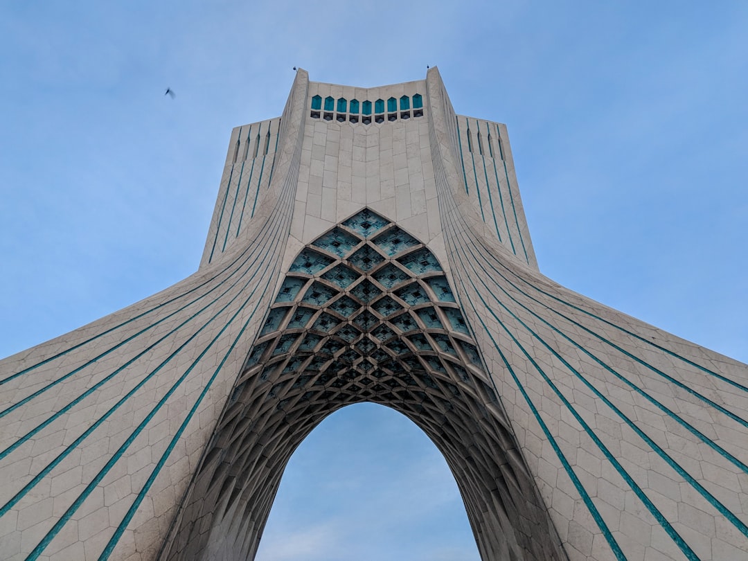 low angle photography of gray concrete building,