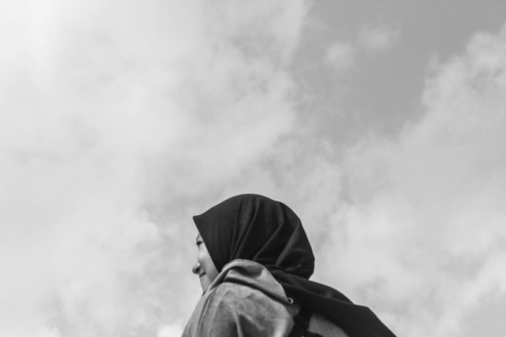 grayscale photo of person in hoodie