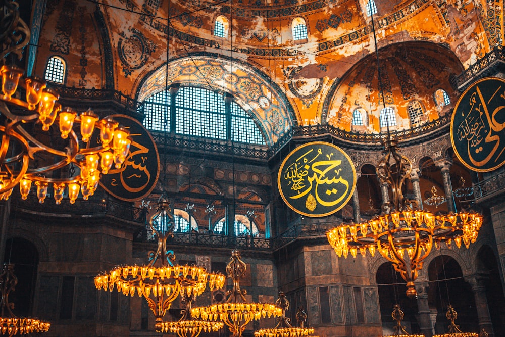 gold and black chandelier inside building