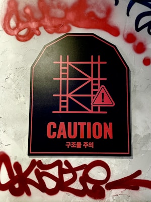 A vibrant safety sign displayed clearly on a construction site wall.