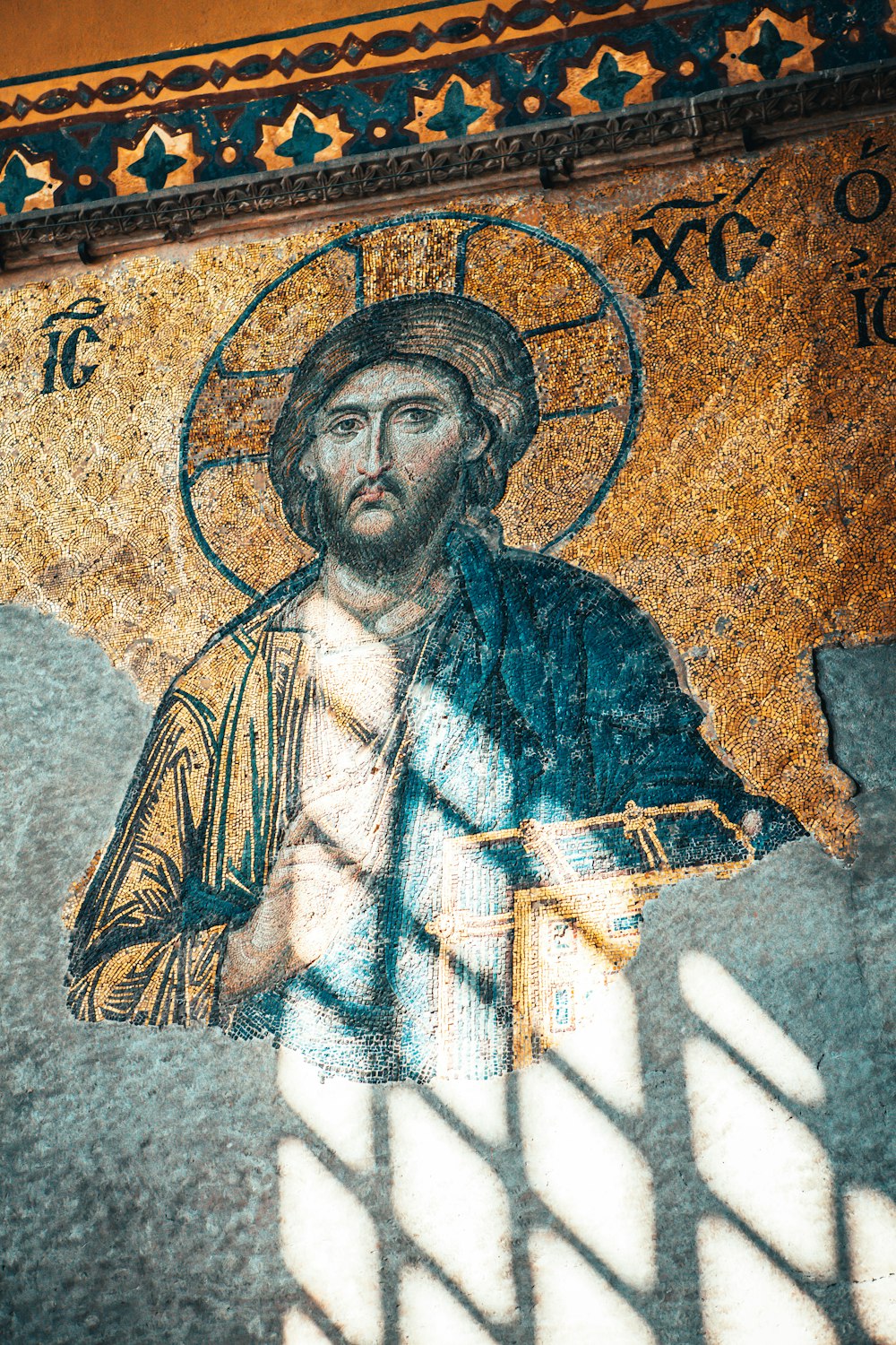 man in blue and white robe painting