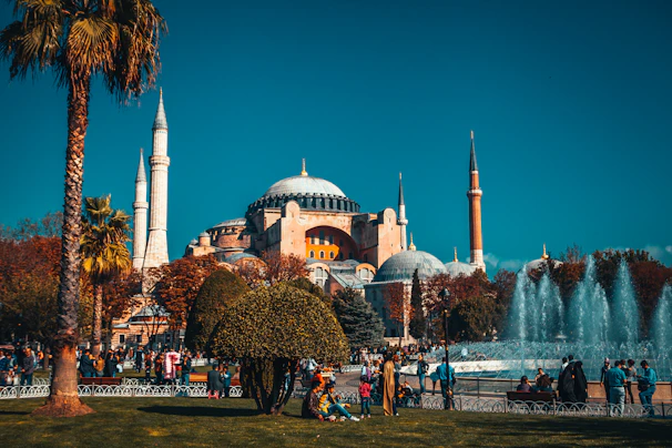 people walking near fountain during daytime