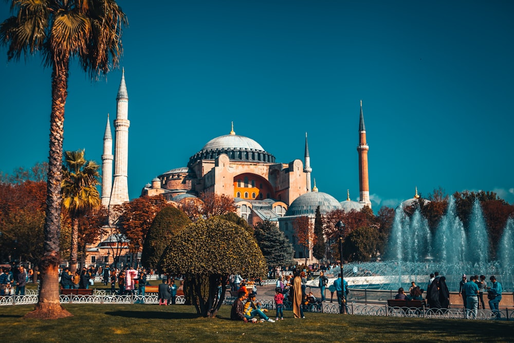 people walking near fountain during daytime