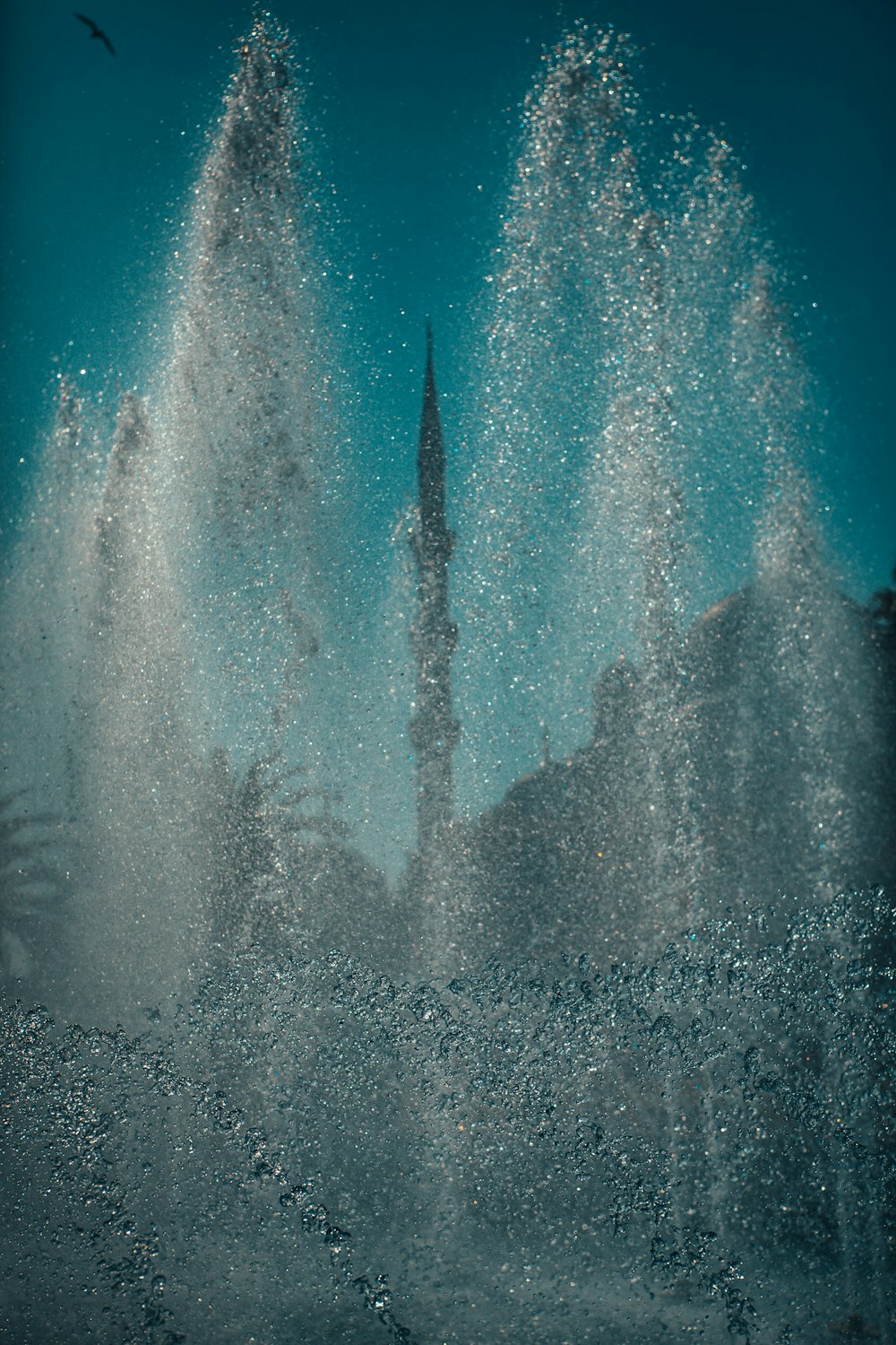 water fountain in the middle of the forest
