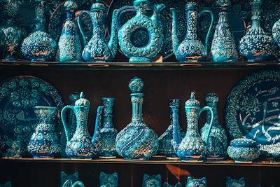 Beautifully crafted Moroccan ceramics arranged on a rustic shelf