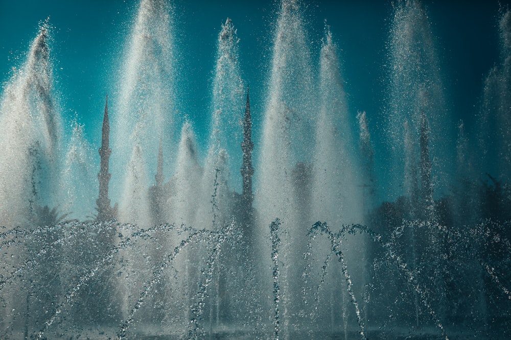 water fountain under blue sky during daytime