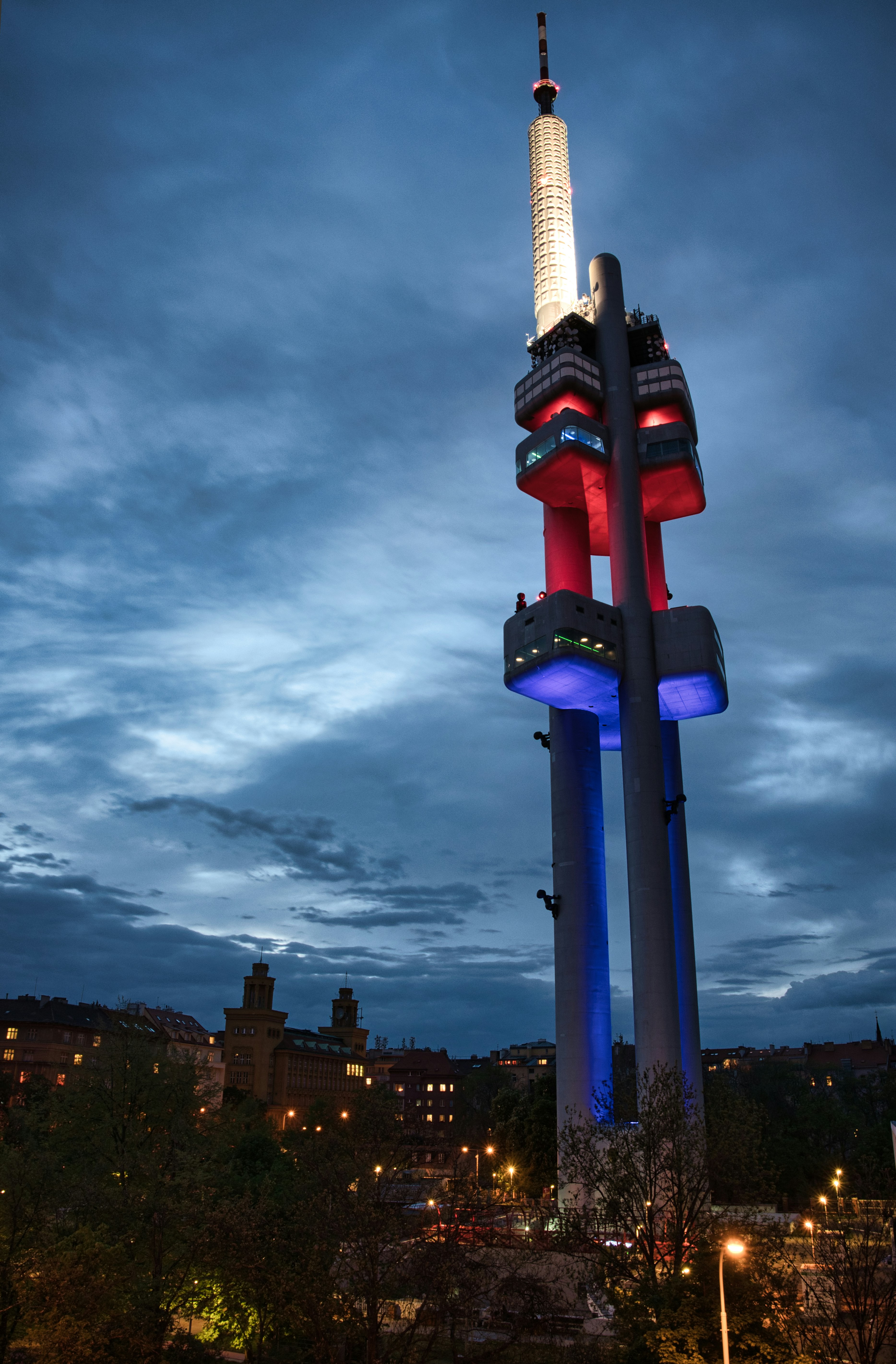 blue and red tower under cloudy sky during daytime