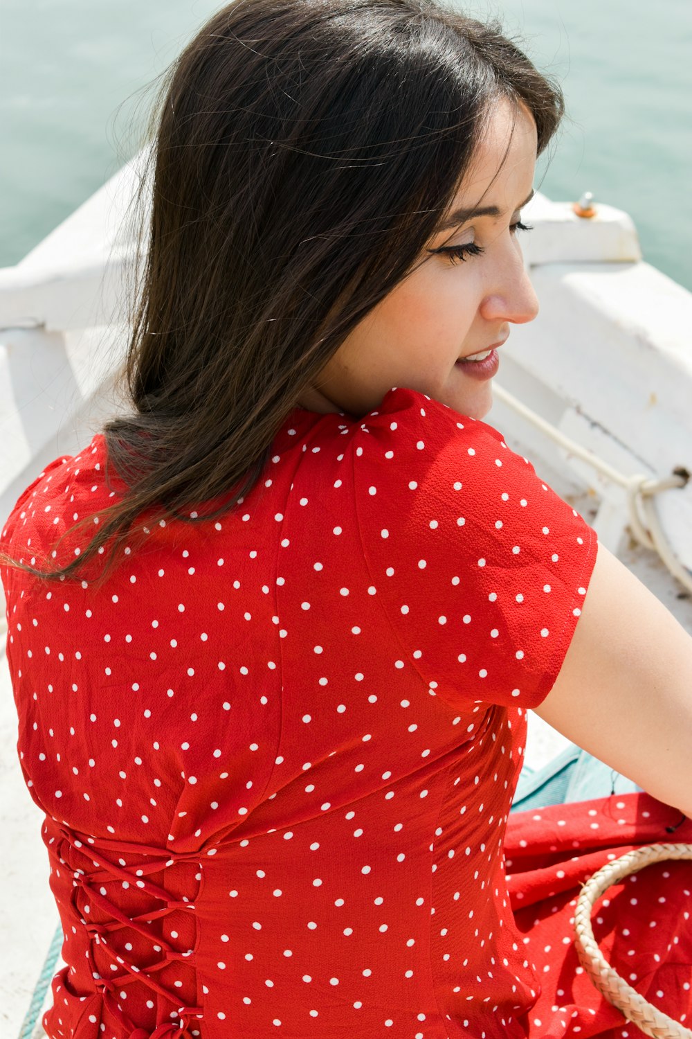 woman in red and white polka dot crew neck t-shirt
