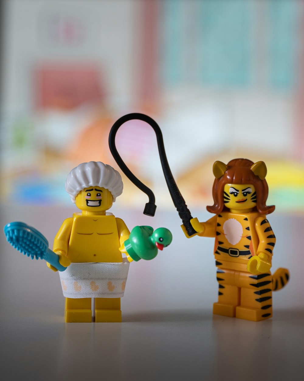 lego minifig holding black hose