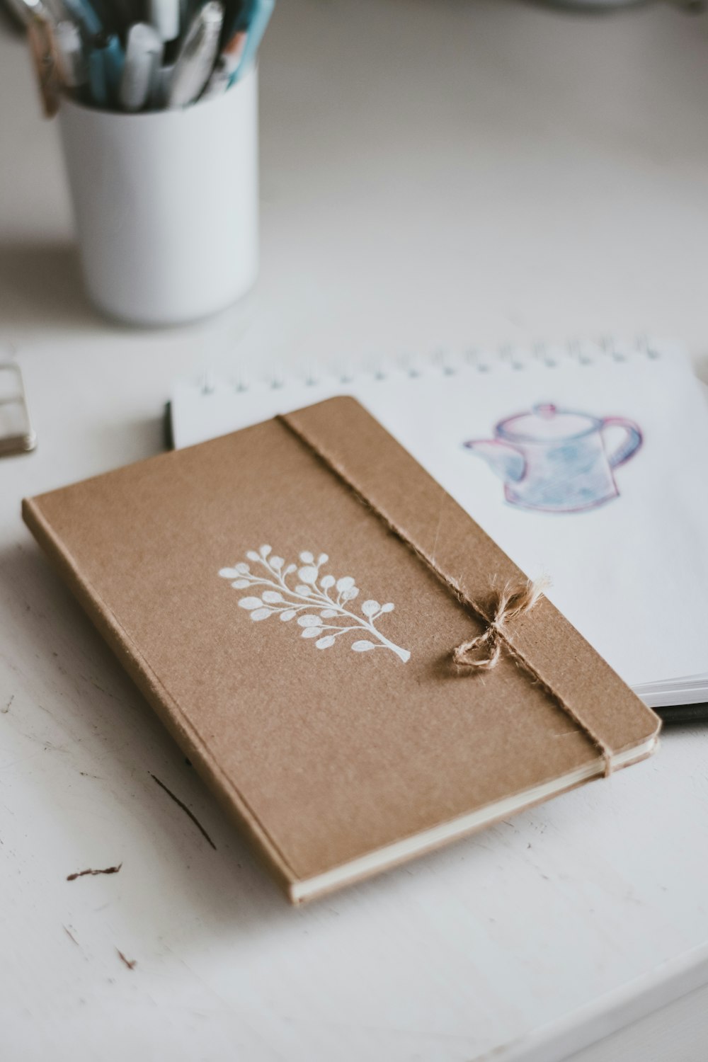 brown and white floral book