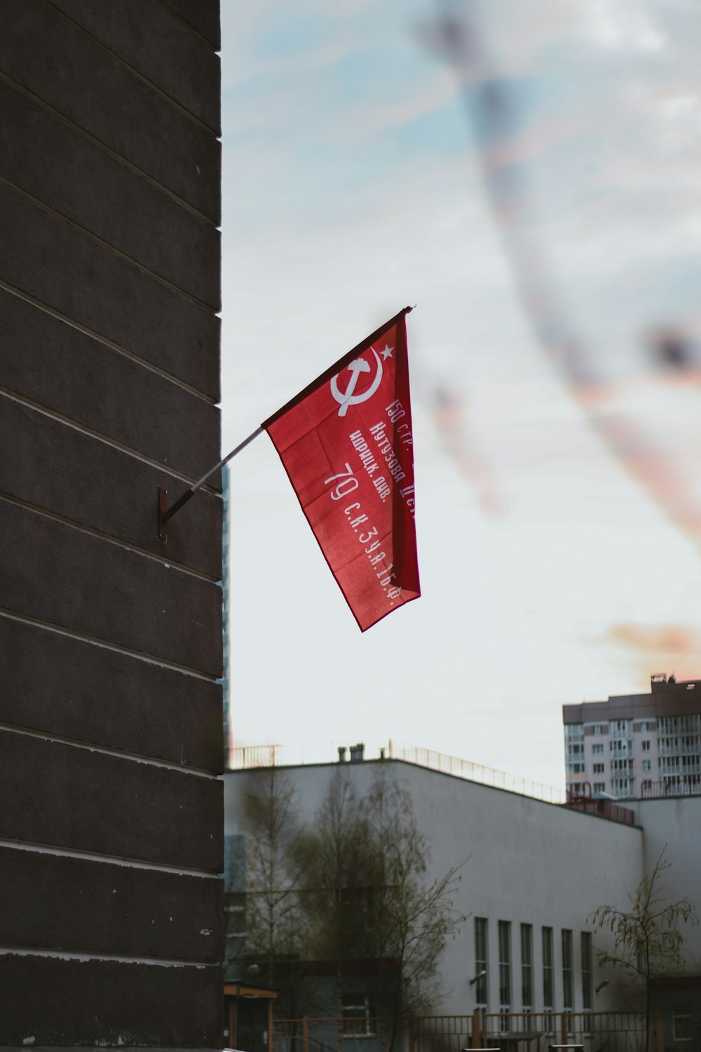 red and white flag on pole