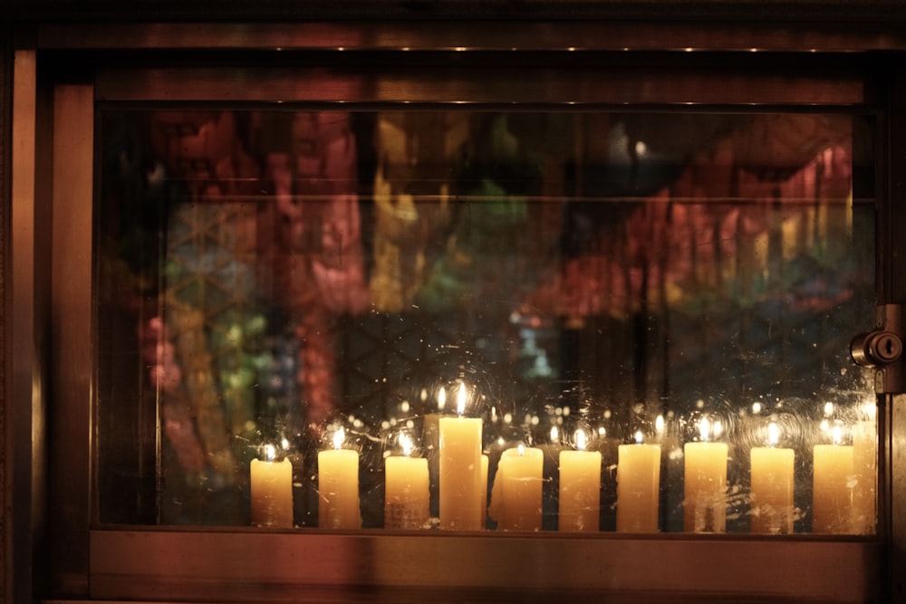 candles on brown wooden table