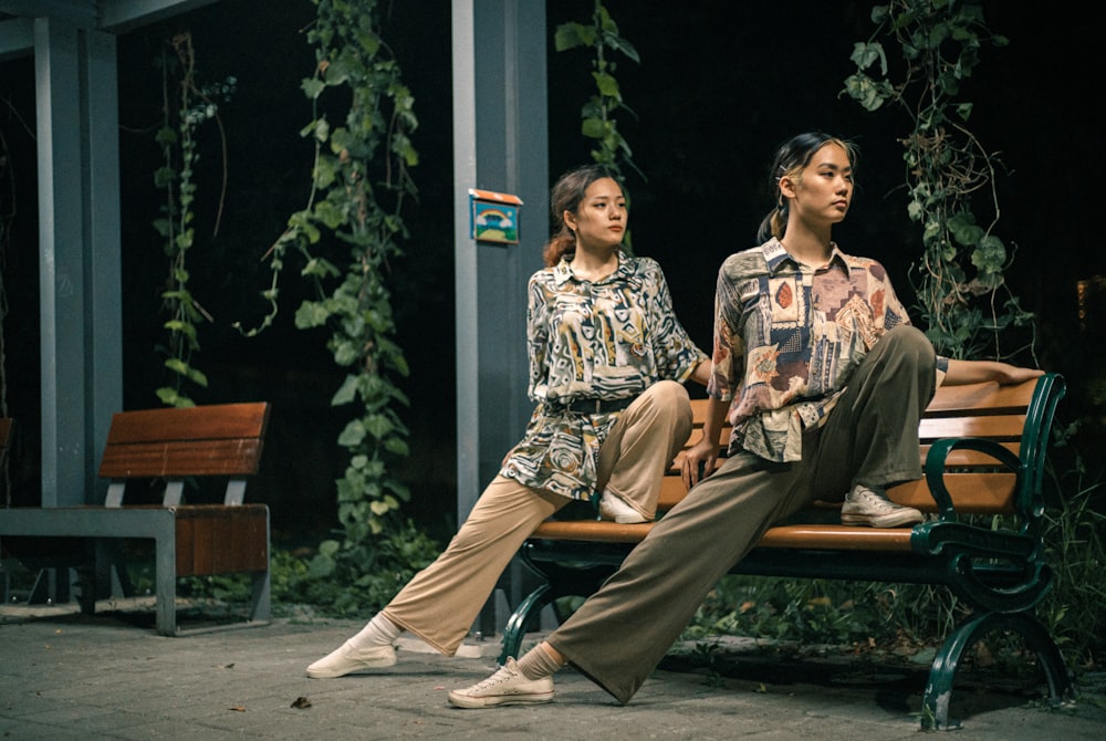 2 women sitting on bench