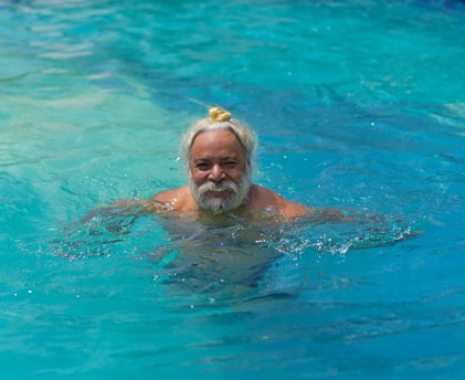 woman in swimming pool during daytime