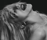 Portrait of a performer mid-expression, embodying raw emotion in a dramatic pose.