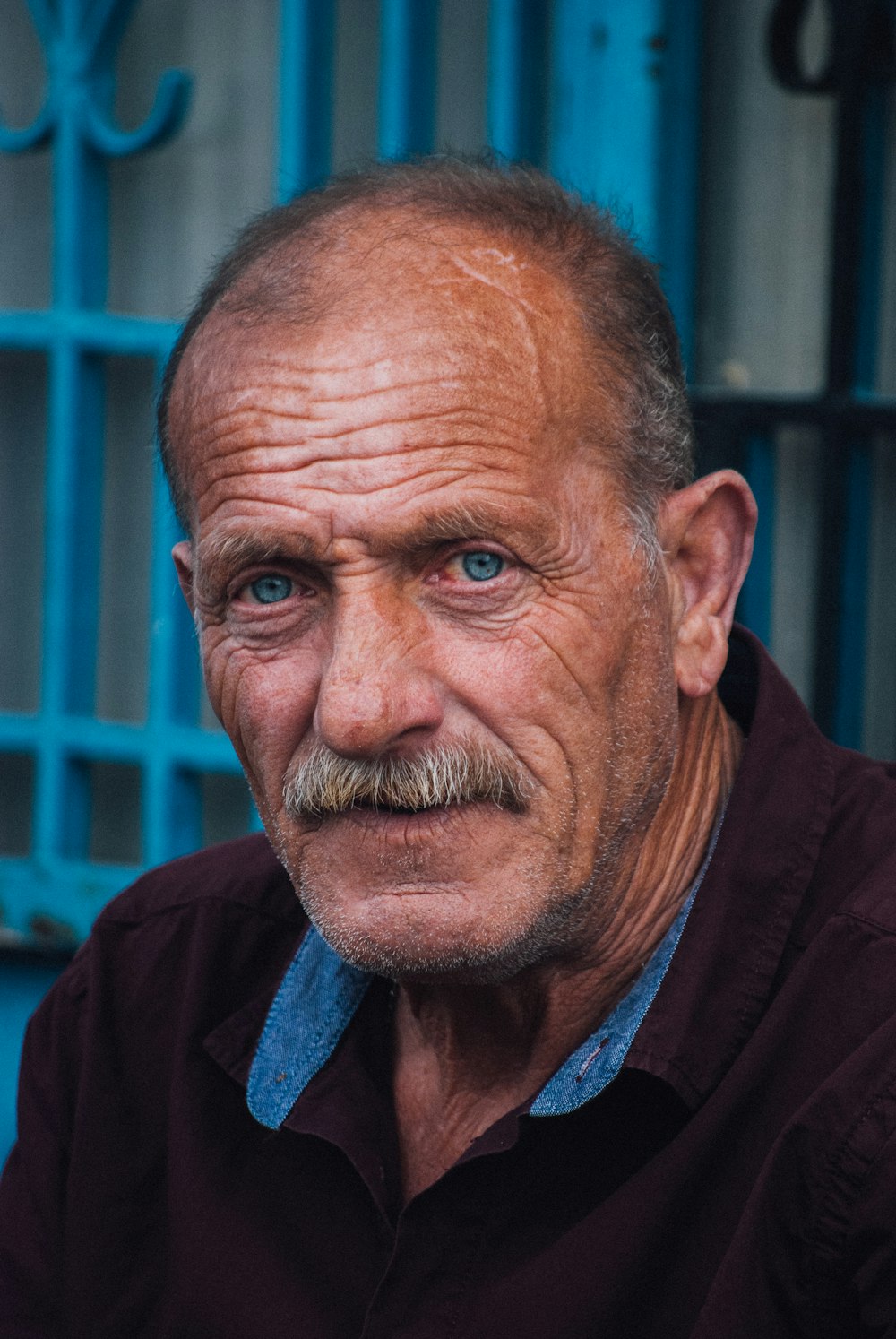 man in black and blue collared shirt