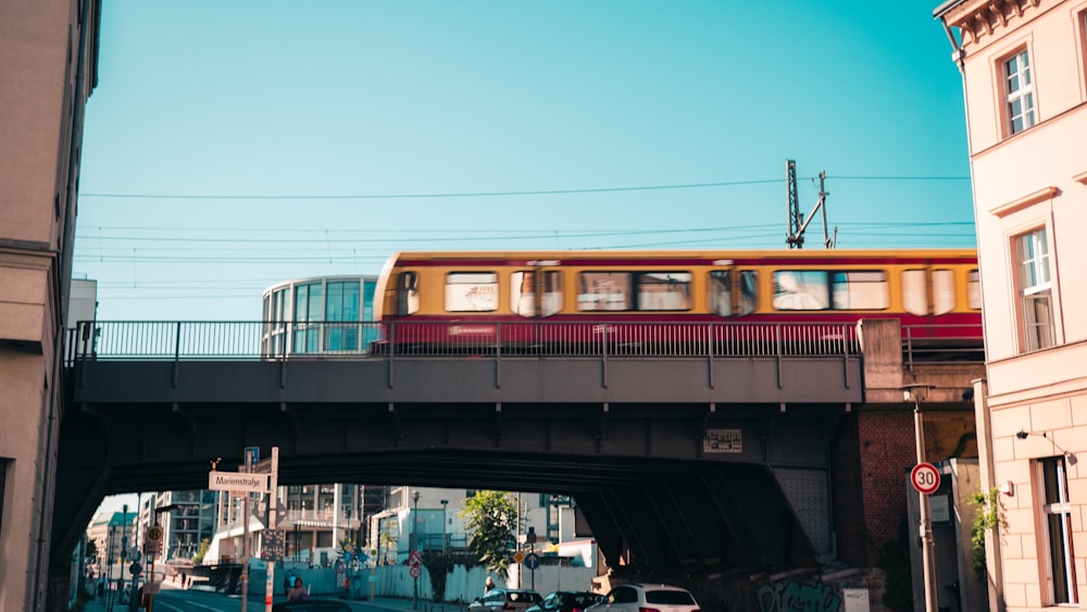 red and white train on rail during daytime