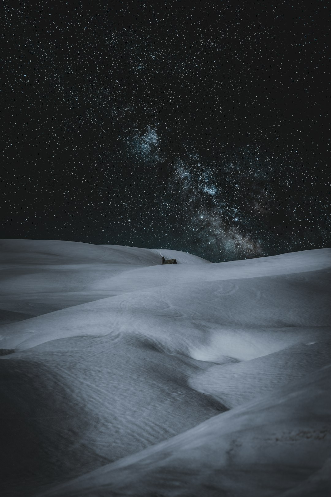 snow covered field during night time